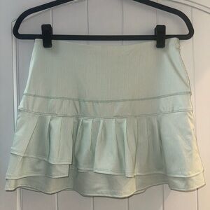Lucky In Love tennis skirt with green and white stripes
